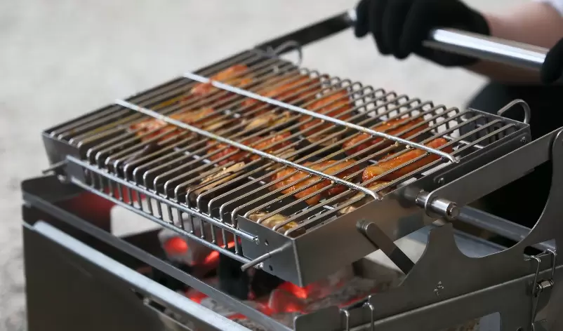 Parrilla giratoria para barbacoa