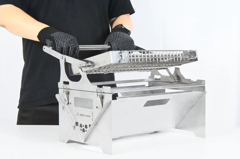 Parrilla giratoria ligera para acampar